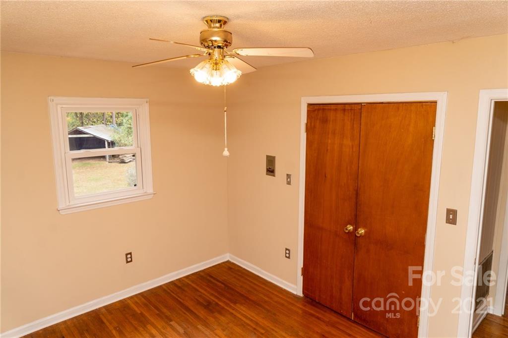 4150 McCoy Street Midland, NC 28107 - Photo 17 of 26 a view of a hallway with wooden floor