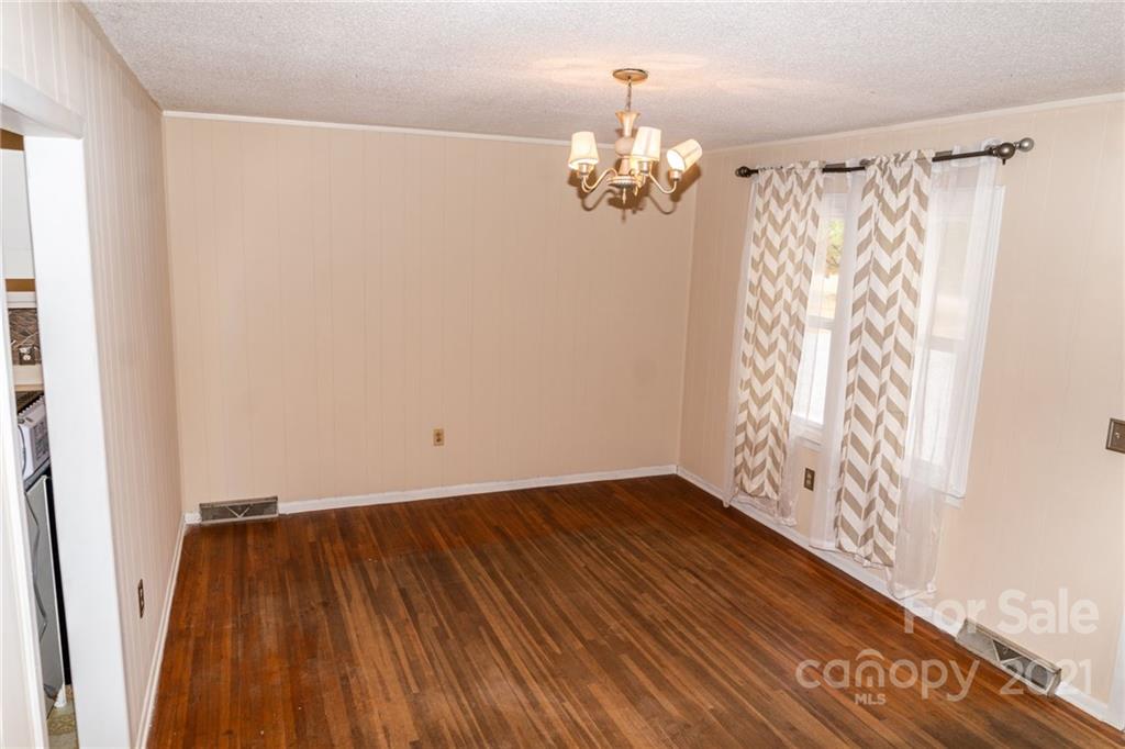 4150 McCoy Street Midland, NC 28107 - Photo 8 of 26 a view of a room with wooden floor and stairs