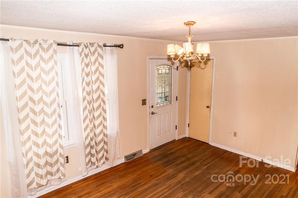 4150 McCoy Street Midland, NC 28107 - Photo 9 of 26 a view of a chandelier in an empty room