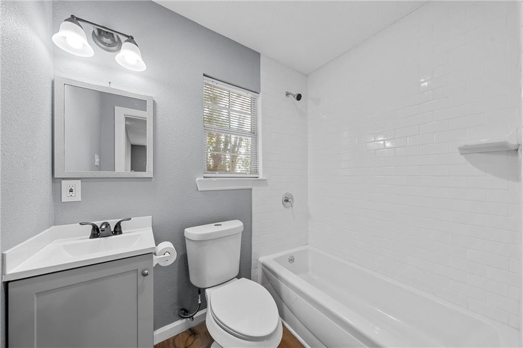 12932 Old Dallas Road West, TX 76691 - Photo 8 of 16 a bathroom with a sink toilet and shower