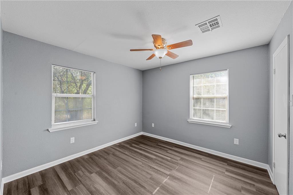 12932 Old Dallas Road West, TX 76691 - Photo 9 of 16 a view of an empty room with a window and a dresser