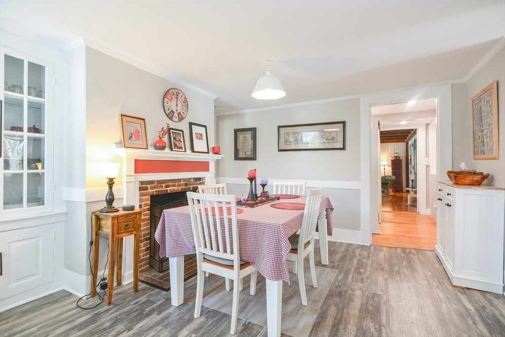 72 Appledor Road, Unit A Framingham, MA 01701 - Photo 15 of 39 a view of a dining room with furniture a chandelier and wooden floor