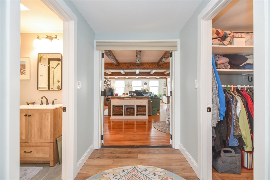 72 Appledor Road, Unit A Framingham, MA 01701 - Photo 27 of 39 a view of a hallway with wooden floor and windows