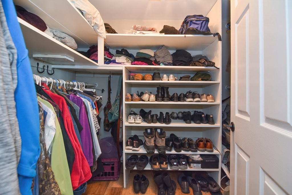 72 Appledor Road, Unit A Framingham, MA 01701 - Photo 28 of 39 a view of walk in closet with clothes and shoes