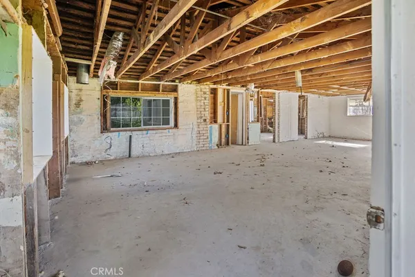a view of a room with wooden walls