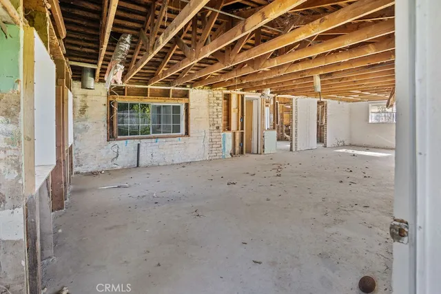 a view of a room with wooden walls