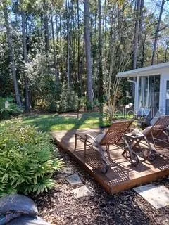 a view of a backyard with sitting area