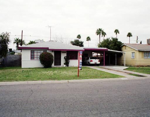 a view of a house with a yard and garage