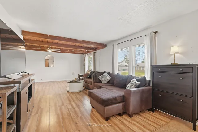 a kitchen with a stove a sink and a refrigerator