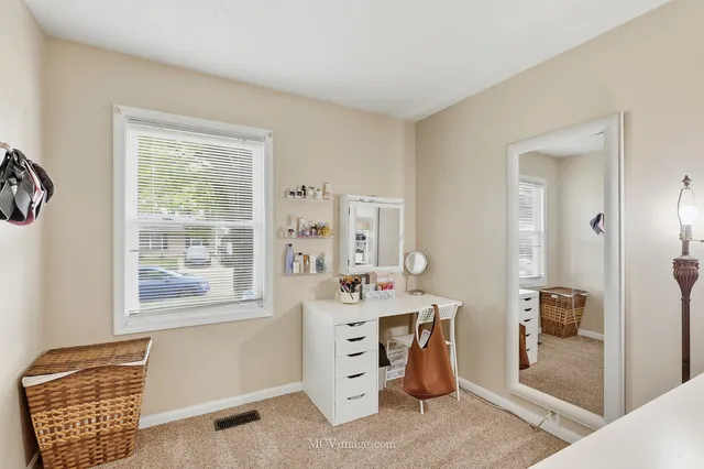 a bedroom with furniture and a window
