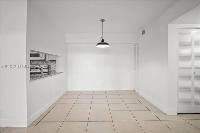 a view of an empty room and window