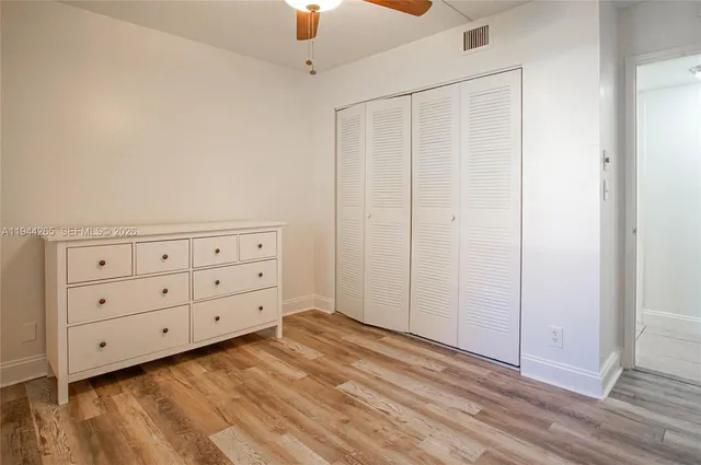 a view of a dresser with wooden floor
