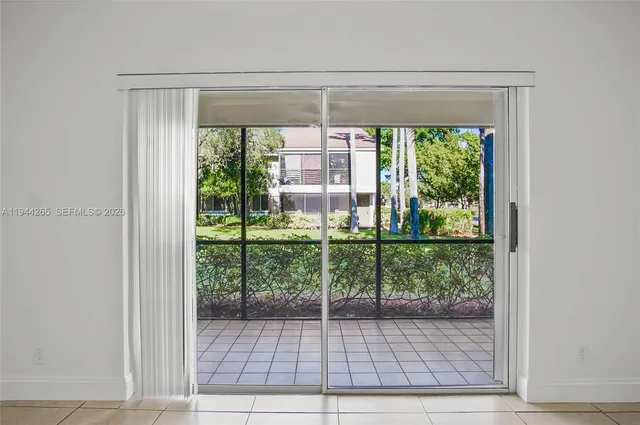 a view of a room that has a large window