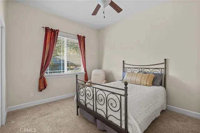 a view of a bedroom with window dresser and hallway