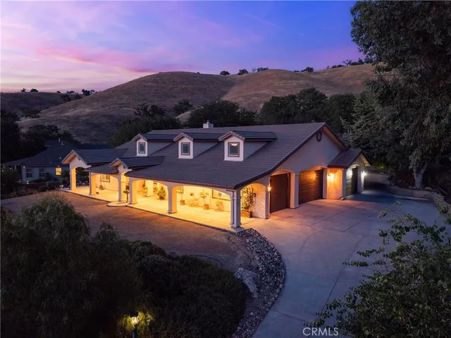 a view of a street with a house in the background