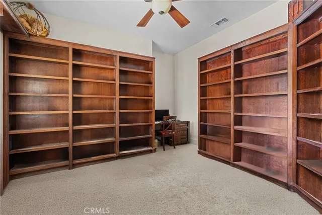 a view of an empty room with empty shelves
