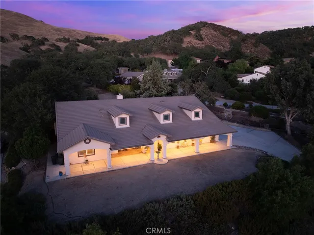 an aerial view of a house with mountain view