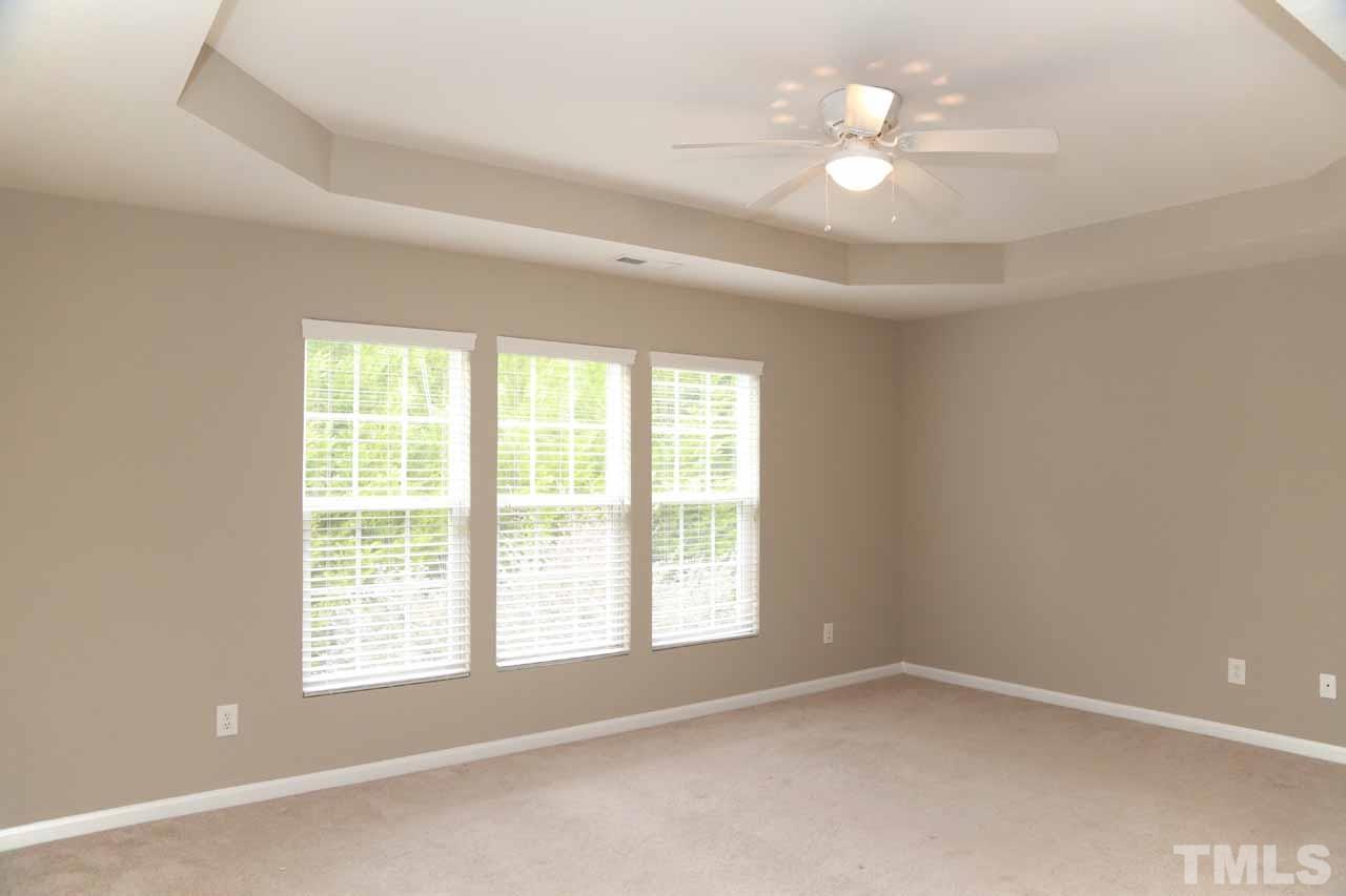 7114 Racine Way Raleigh, NC 27615 - Photo 14 of 23 wooden floor in an empty room with a window