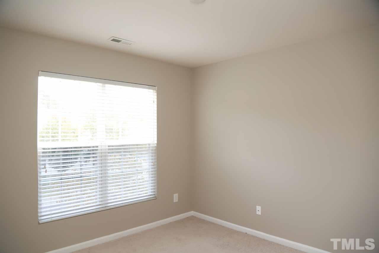 7114 Racine Way Raleigh, NC 27615 - Photo 10 of 23 an empty room with a window