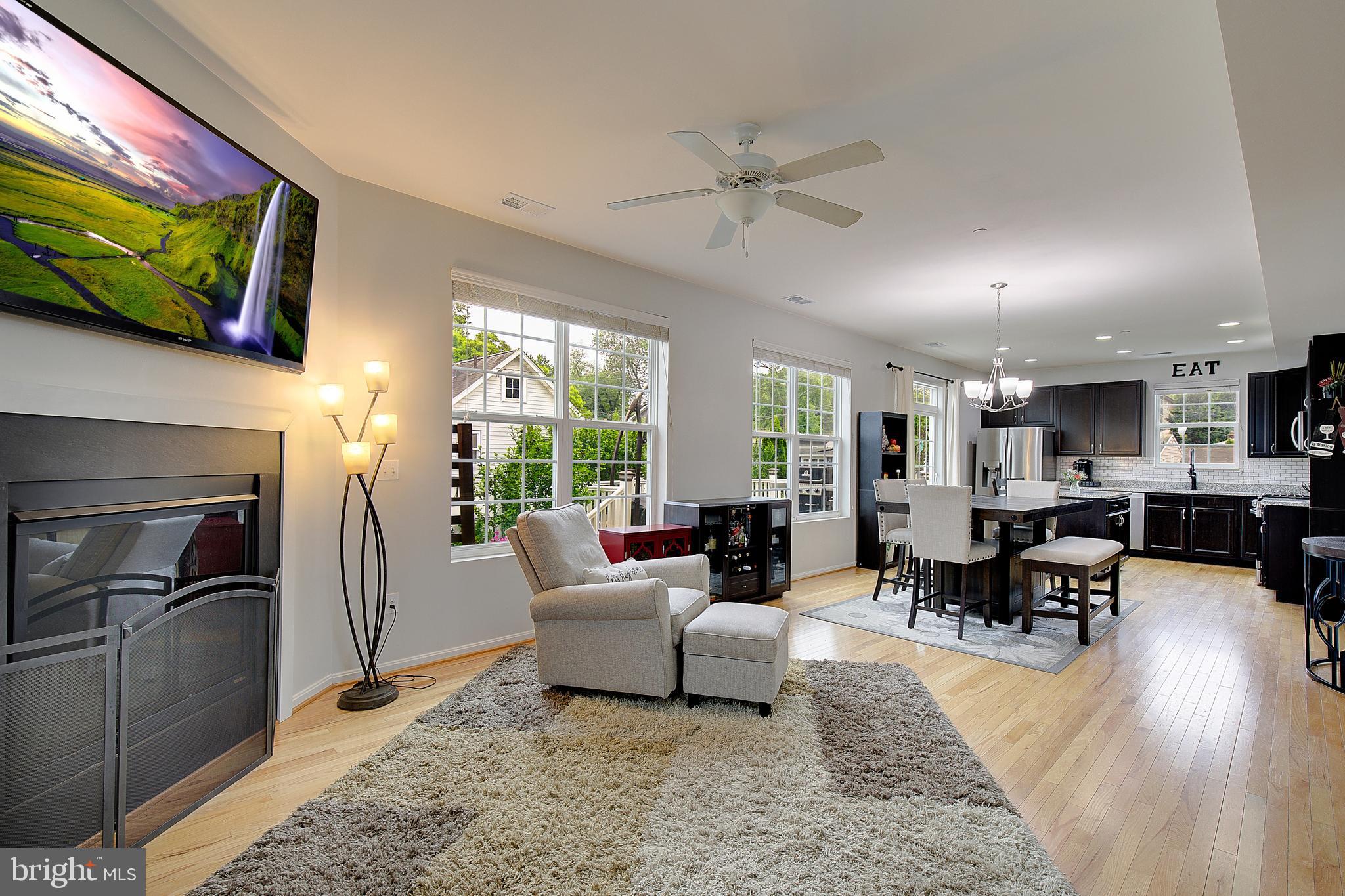 403 Venton Road Edgewater, MD 21037 - Photo 11 of 62 a living room with furniture wooden floor and a flat screen tv