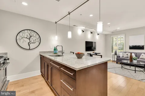 a view of a kitchen with a table and chairs