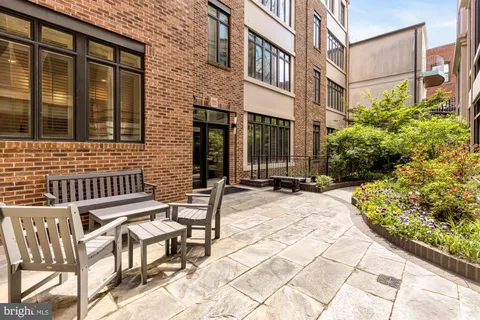 a view of a brick building with many windows