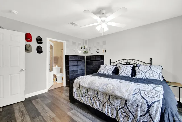 a bedroom with a bed and a dresser