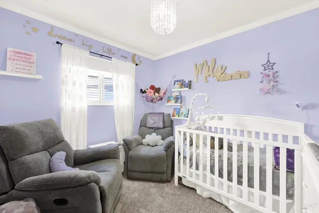 a bedroom with furniture and a window