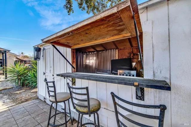 a view of house with outdoor seating