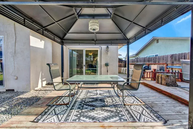 a sitting area with furniture and wooden floor