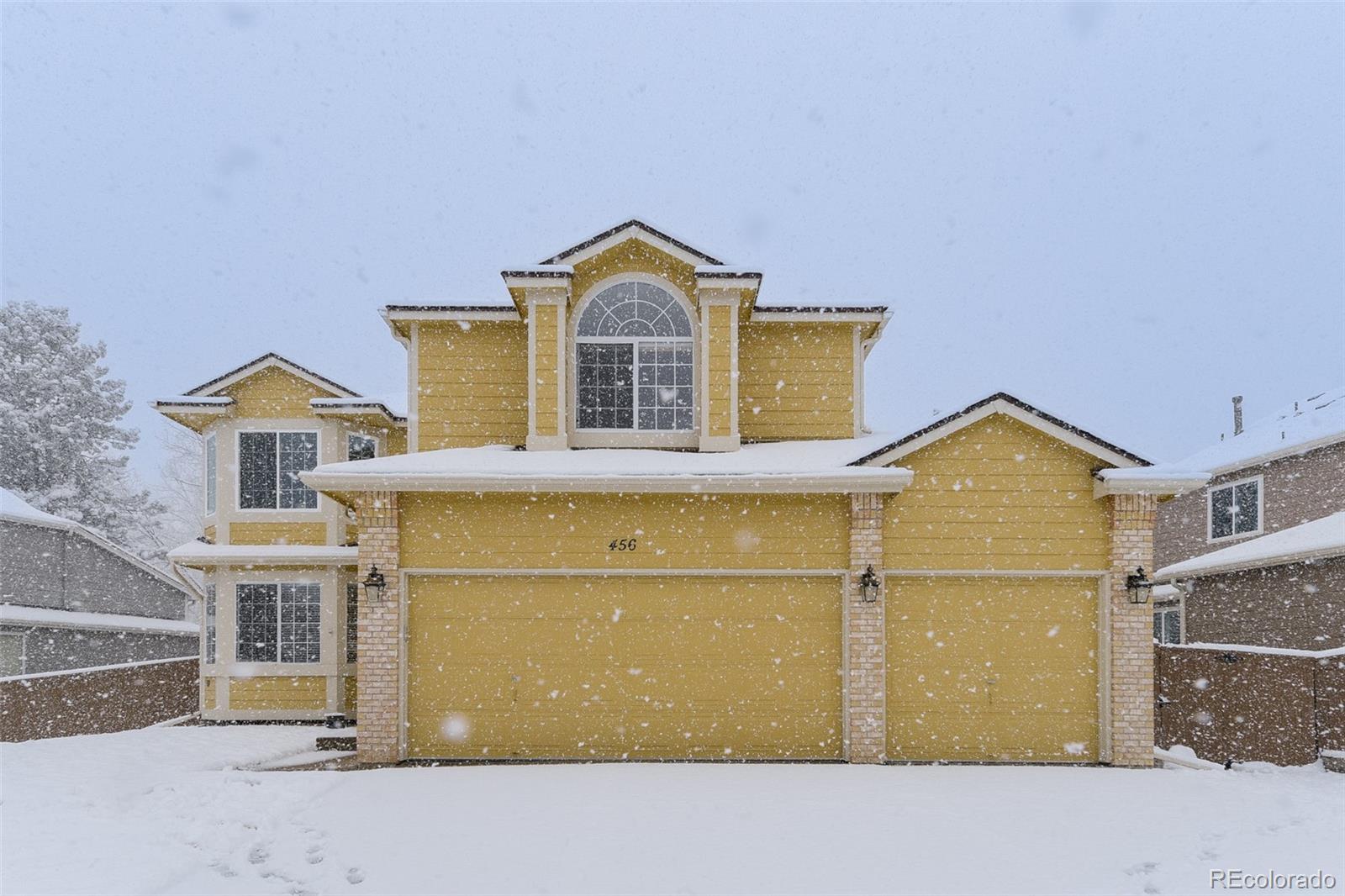 456 Bexley Lane Highlands Ranch, CO 80126 - Photo 1 of 28 a front view of a house with a yard