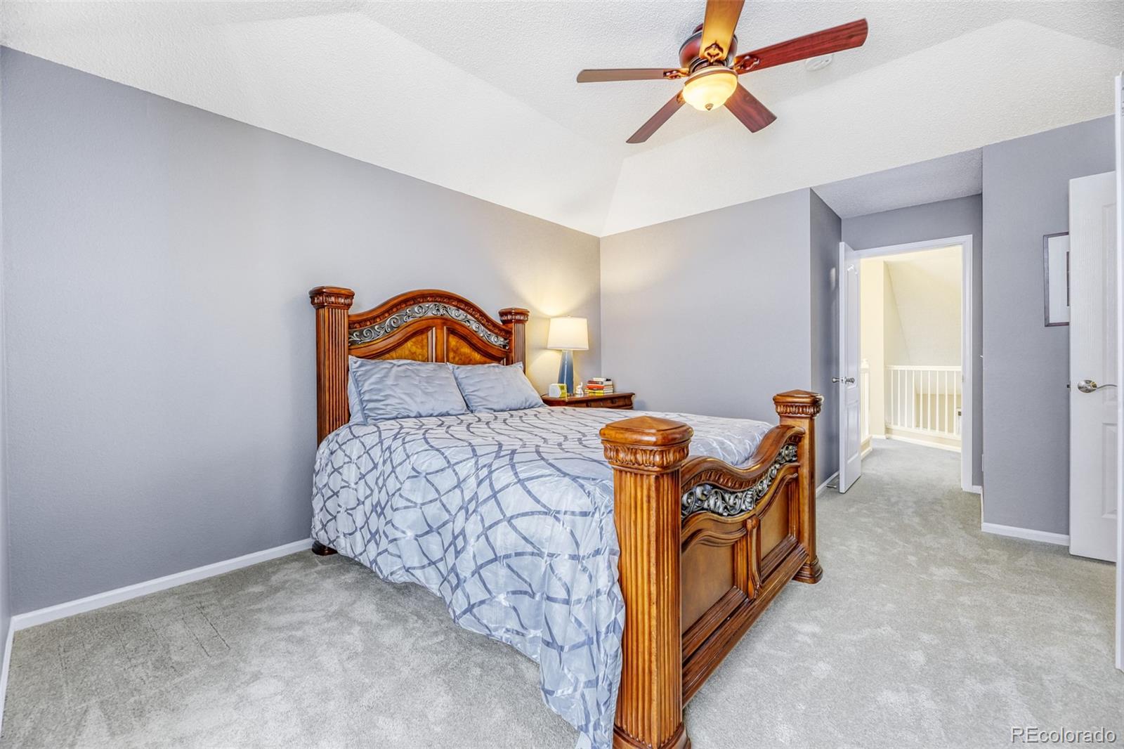 456 Bexley Lane Highlands Ranch, CO 80126 - Photo 15 of 28 a bedroom with a bed and ceiling fan