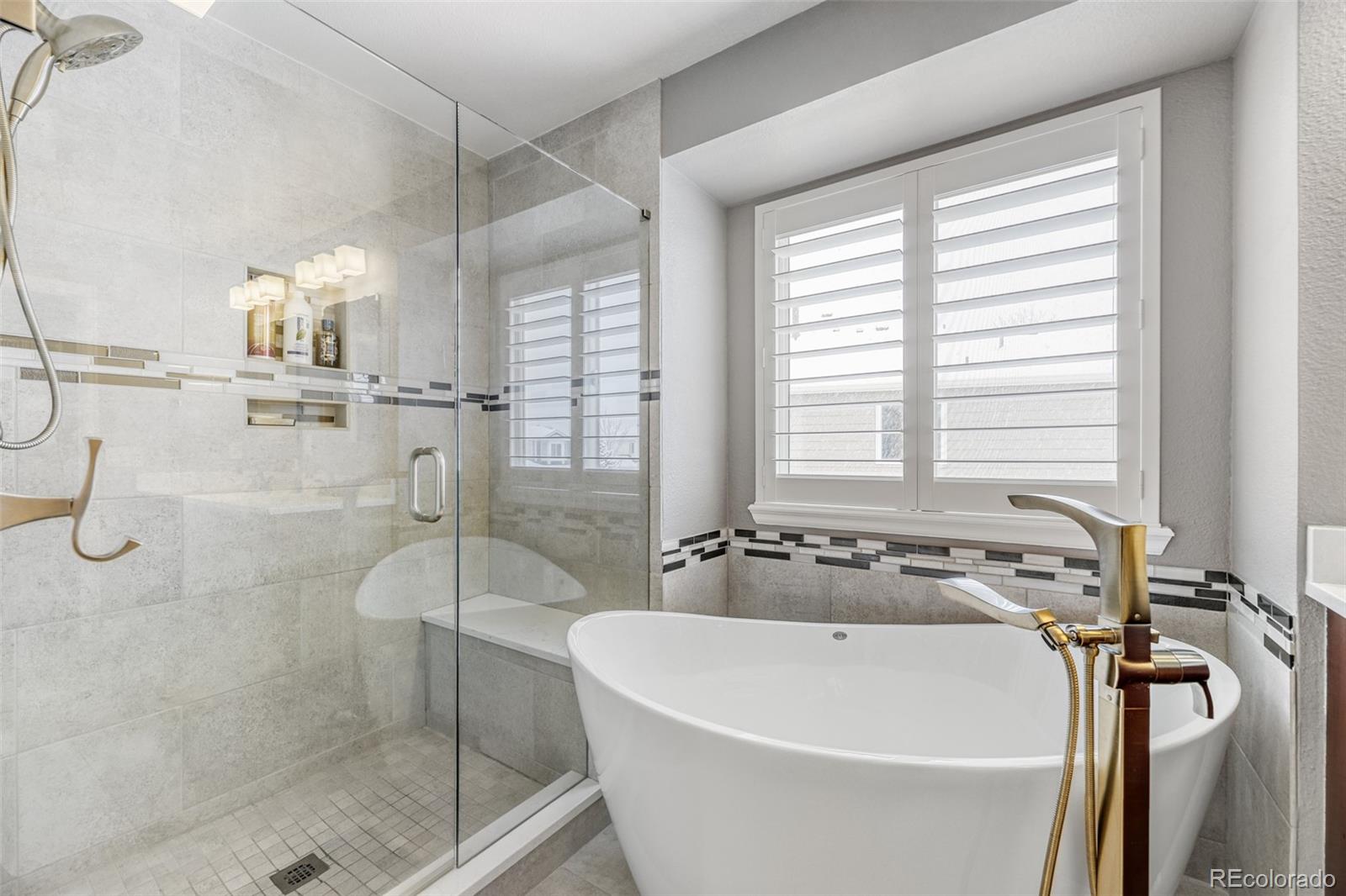 456 Bexley Lane Highlands Ranch, CO 80126 - Photo 18 of 28 a white bath tub sitting next to a shower