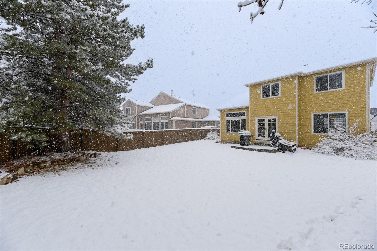 456 Bexley Lane Highlands Ranch, CO 80126 - Photo 27 of 28 a view of a house with a snow in front of it