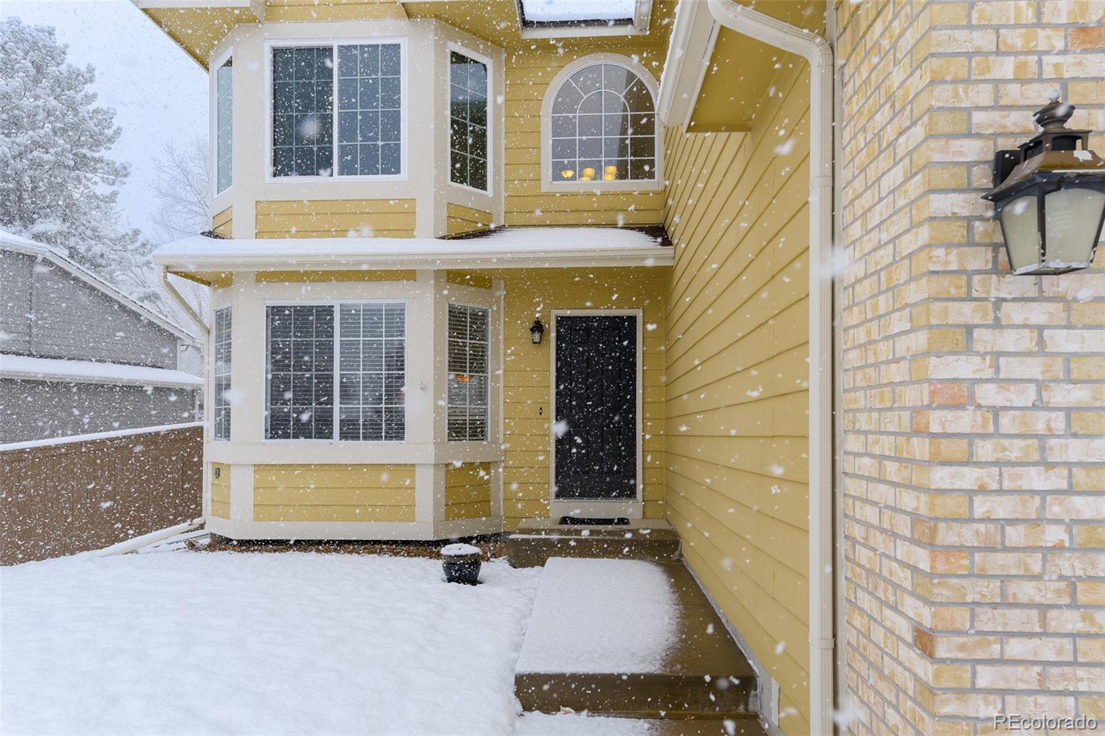 456 Bexley Lane Highlands Ranch, CO 80126 - Photo 3 of 28 a view of a brick building with a outdoor space