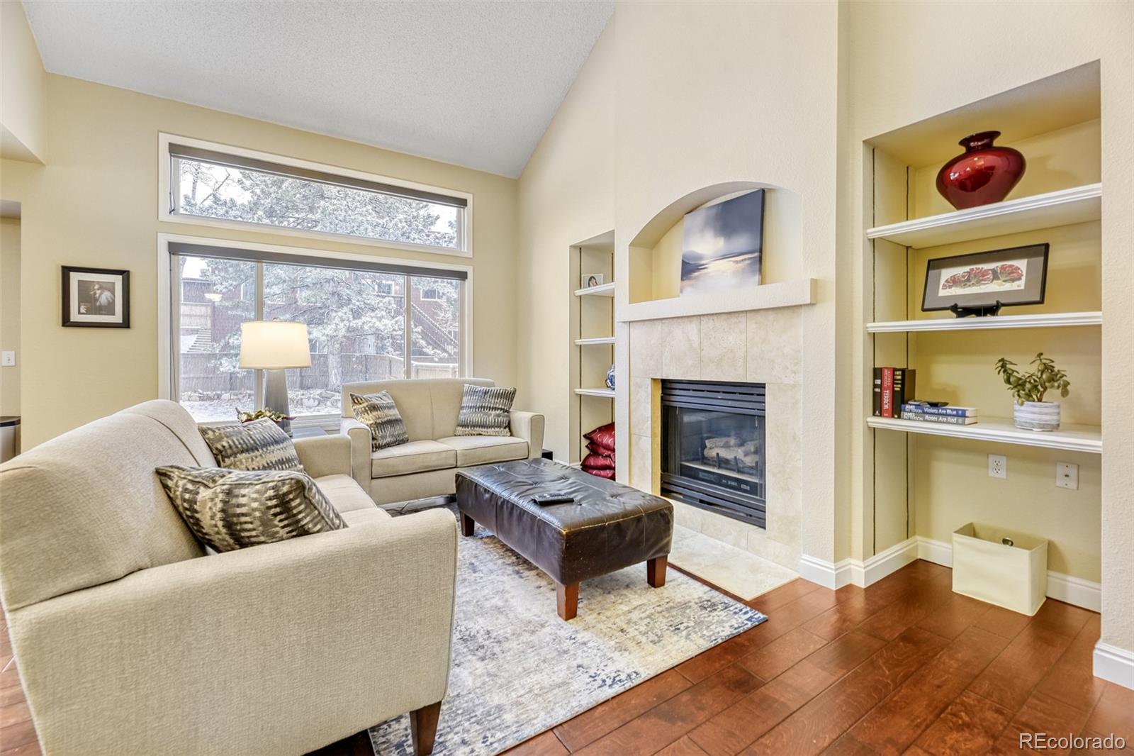 456 Bexley Lane Highlands Ranch, CO 80126 - Photo 6 of 28 a living room with furniture fireplace and window