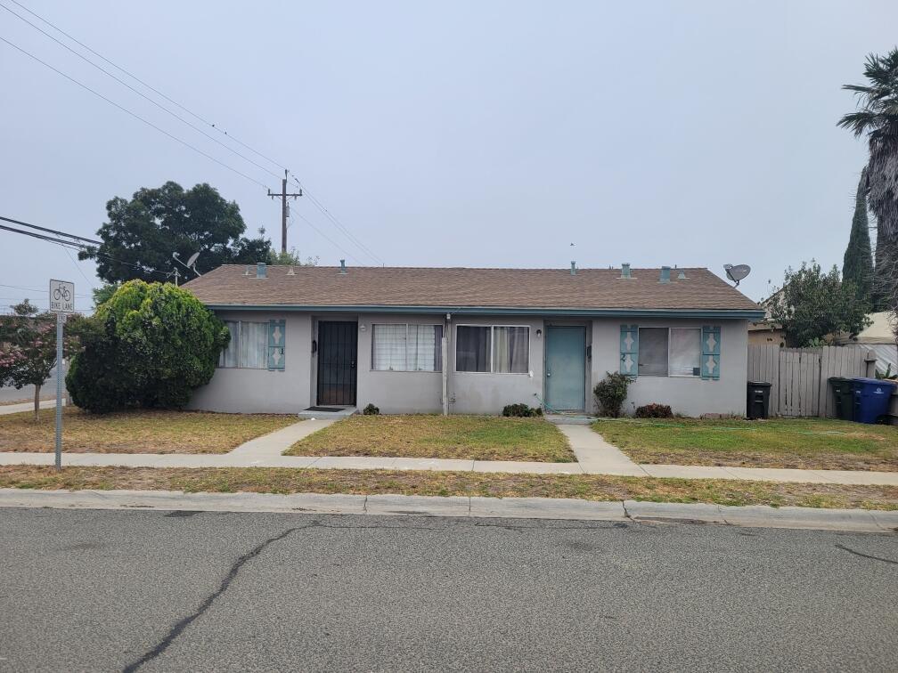 201 Park Street Soledad, CA 93960 - Photo 1 of 1 a view of a house with basketball space and a car parked on the road