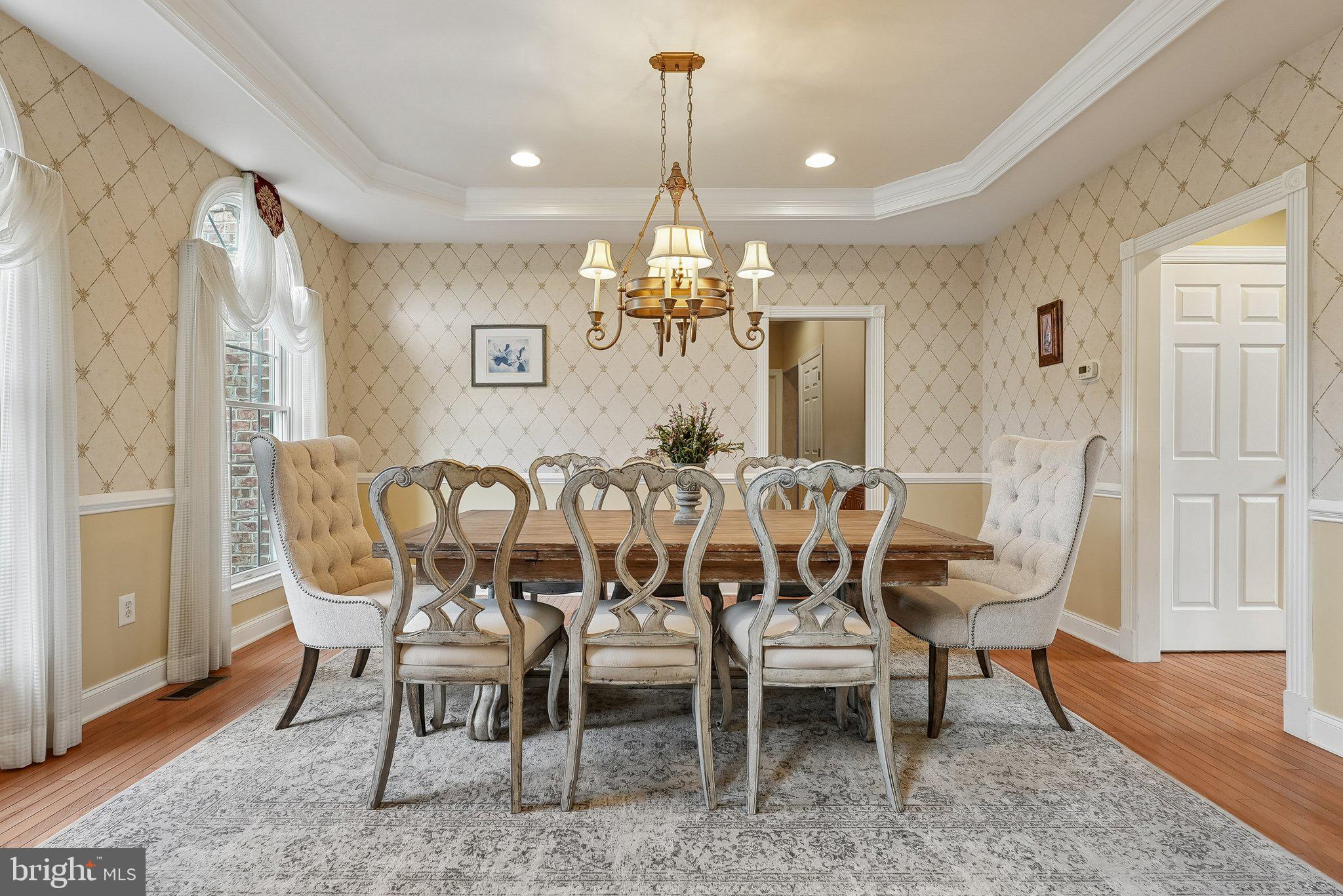 1 Baker Way Pennington, NJ 08534 - Photo 11 of 77 a dining room with furniture a chandelier and wooden floor