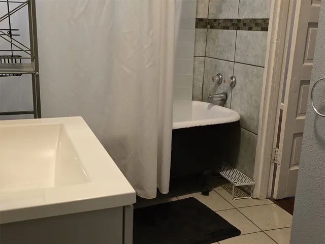 a bathroom with a sink and mirror