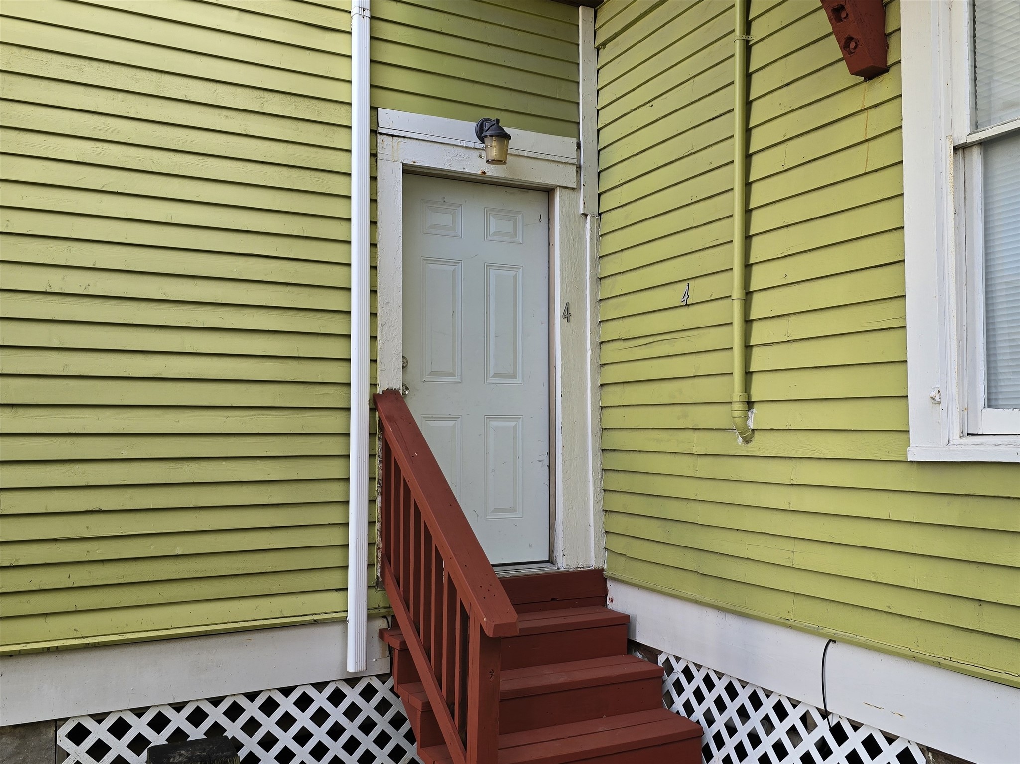 1614 Market Street, Unit 4 Galveston, TX 77550 - Photo 5 of 19 a view of a porch with wooden stairs