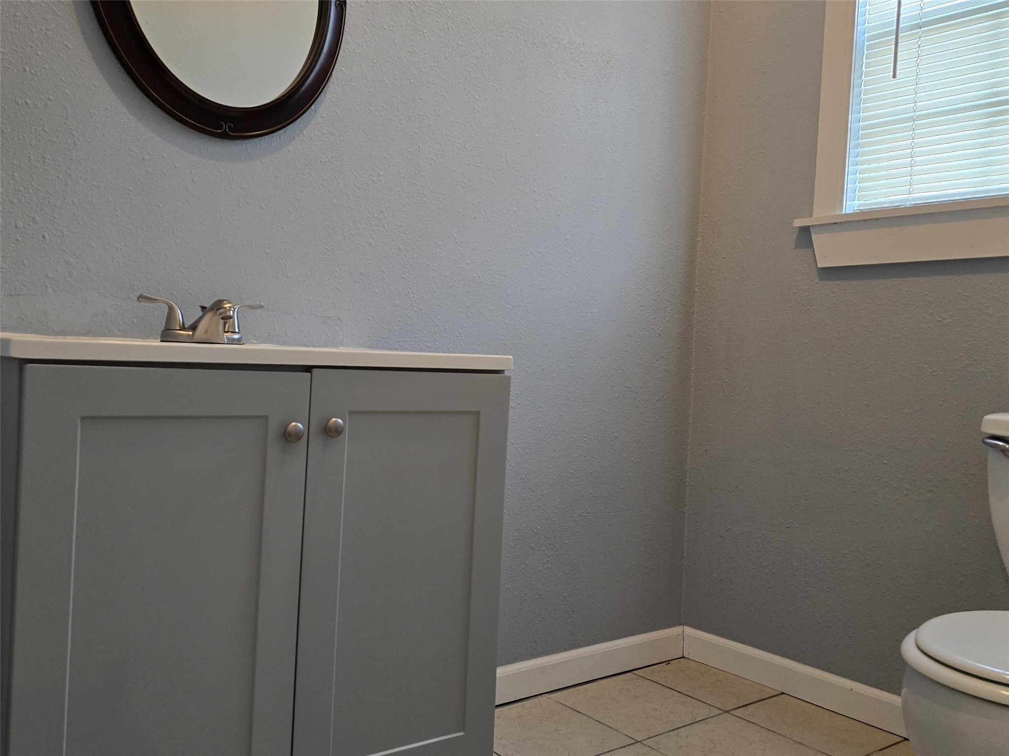 1614 Market Street, Unit 4 Galveston, TX 77550 - Photo 10 of 19 a bathroom with a toilet and a sink