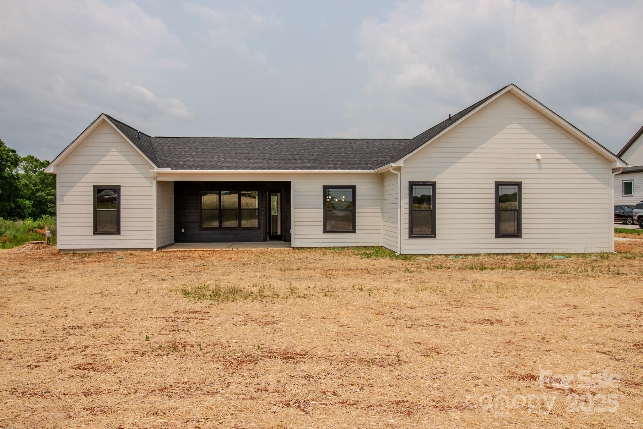 1429 Coppergate Drive Salisbury, NC 28147 - Photo 30 of 37 a view of a house with a yard and garage