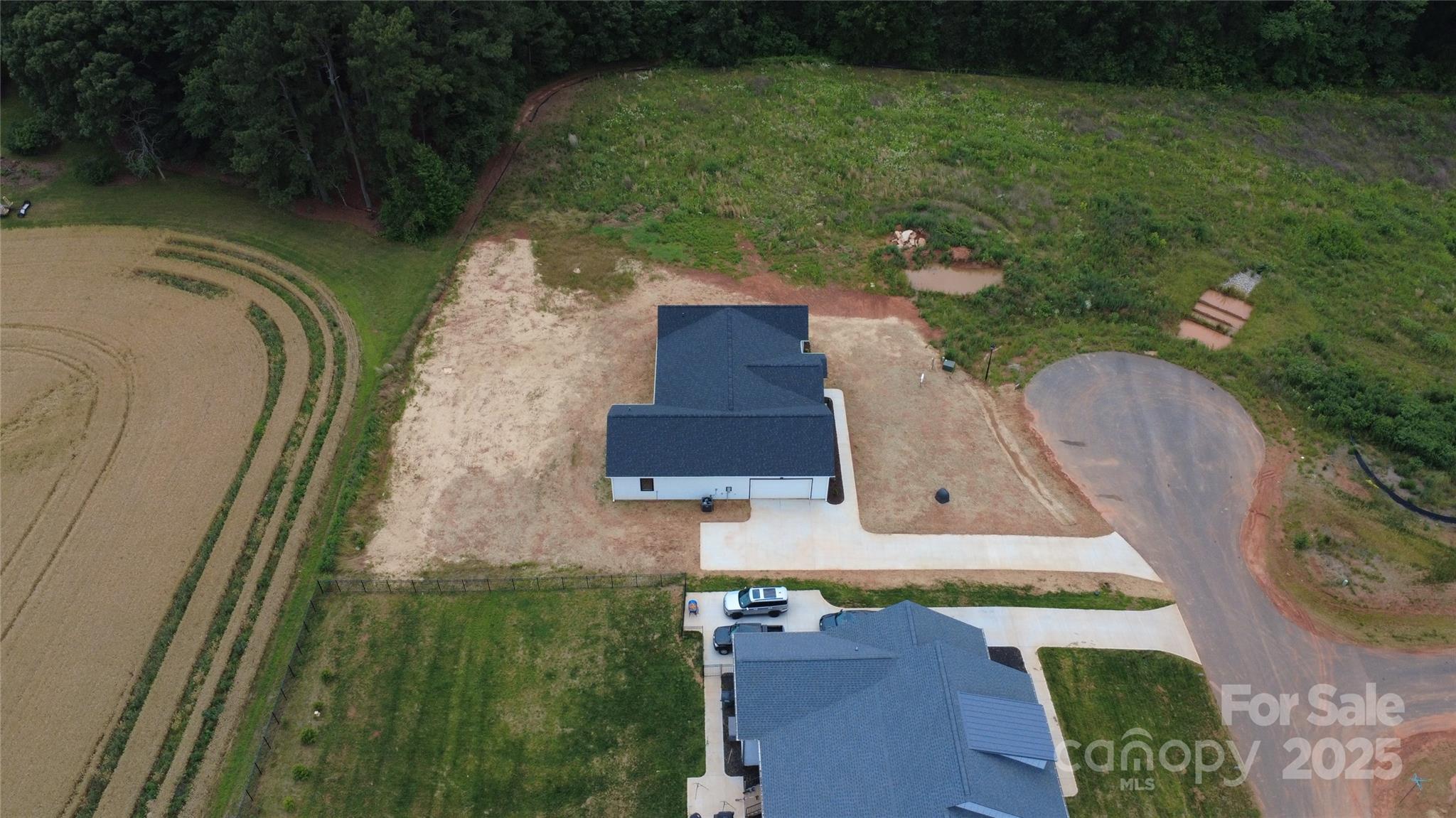 1429 Coppergate Drive Salisbury, NC 28147 - Photo 35 of 37 an aerial view of a house with outdoor space pool seating area and covered with green space