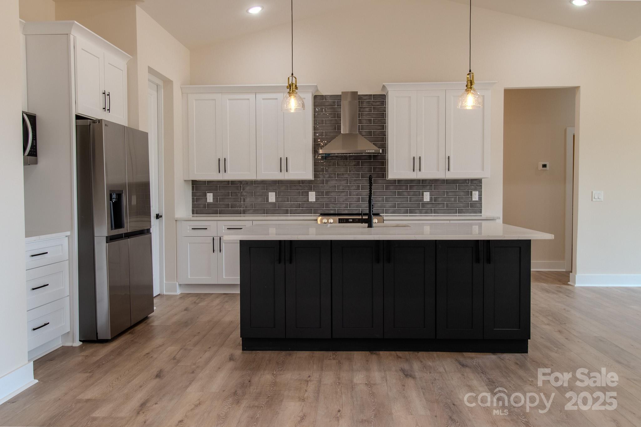 1429 Coppergate Drive Salisbury, NC 28147 - Photo 9 of 37 a kitchen with kitchen island granite countertop a sink cabinets and stainless steel appliances