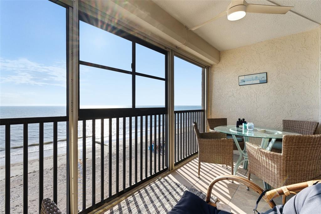 15462 Gulf Boulevard, Unit 406 Madeira Beach, FL 33708 - Photo 14 of 48 a view of a dining room with furniture window and outside view