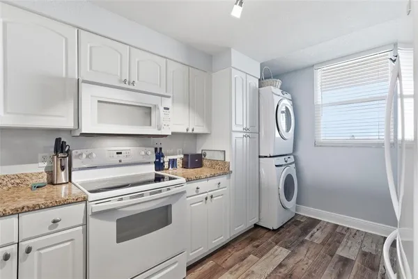 a close view of a utility room with dryer and washer