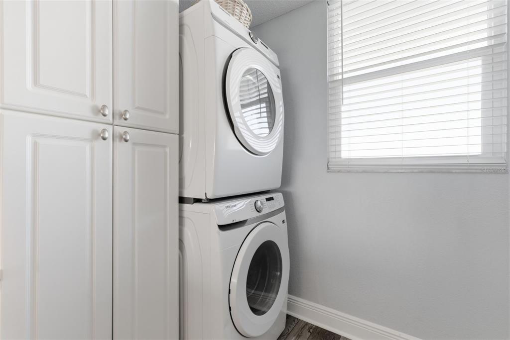15462 Gulf Boulevard, Unit 406 Madeira Beach, FL 33708 - Photo 21 of 48 a close view of a utility room with dryer and washer