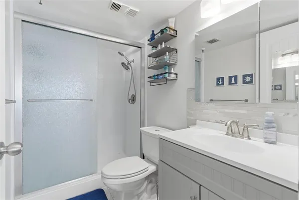 a bedroom with a bed and a table