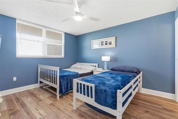 a bedroom with a bed and a table in it