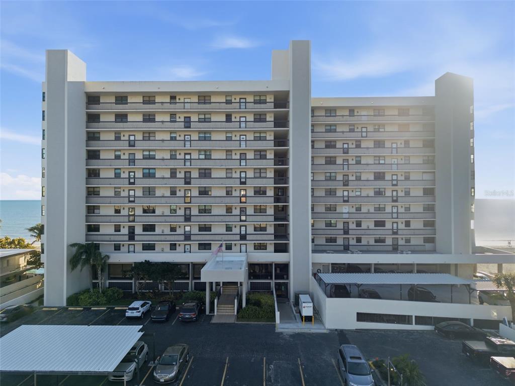 15462 Gulf Boulevard, Unit 406 Madeira Beach, FL 33708 - Photo 3 of 48 a view of a building with a outdoor space